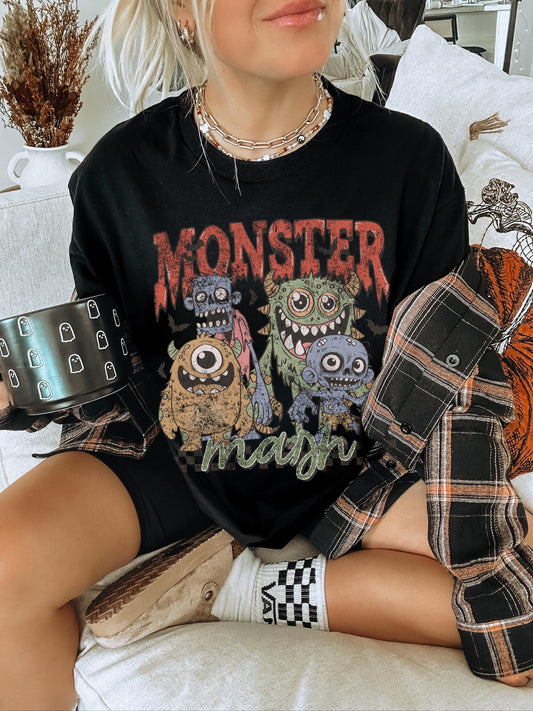 Oversized black halloween graphic tee featuring four different monsters with the words Monster Mash in a distressed print
